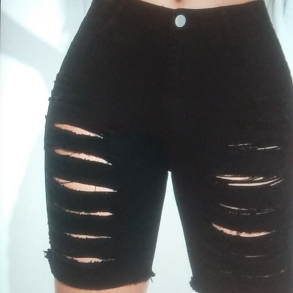 Woman's ripped black jean shorts